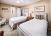 Guest Bedroom with 2 Twin Beds and Floor To Ceiling Sliding Glass Door to Private Juliet Balcony 