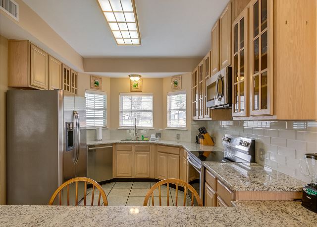 Cook a great meal in the newly updated kitchen with granite counter tops, new back splash, stove, dishwasher and microwave!