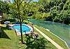 Pool overlooking the river and direct river access!! 
Long grassy waterfront with grills and picnic tables. 