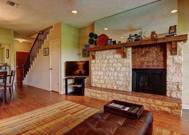 The fireplace creates a wonderful homey feel in this condo.