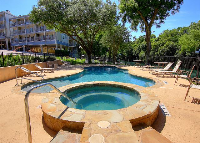 Relax in the hot tub and take in the beauty of the Comal river.