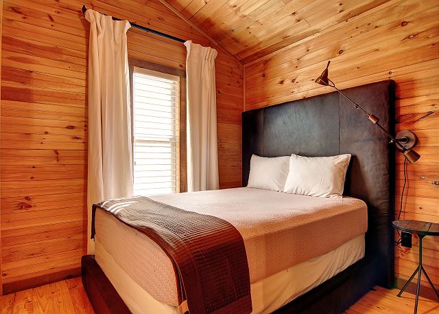 Queen bed in second bedroom of the Apple (main) cabin.