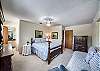 Upstairs master with en suite full bath with walk in shower, queen bed and twin bed.