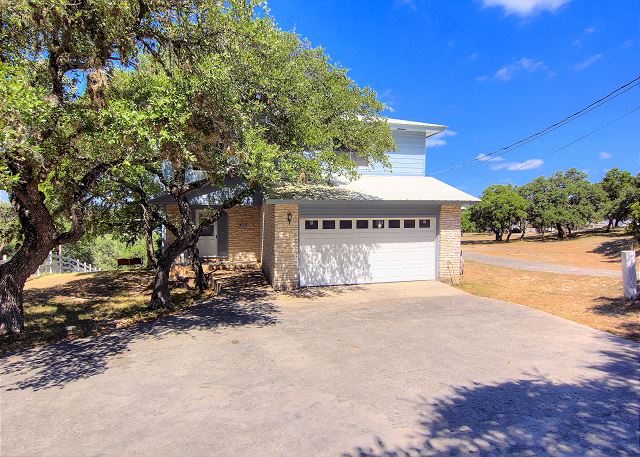 This fabulous home is located on 2 acres with a gentle shoreline at waters edge that is perfect for swimming or fishing.