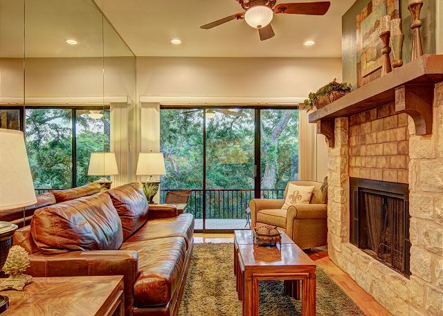 Cozy living room with a fireplace, great views out of the sliding glass door windows and the couch converts to a sleeper for 2 guests. 