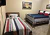 Guest bedroom with a queen and twin bed, also desk for working!