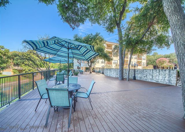 Large deck over looks the swimming pool and the Comal River!