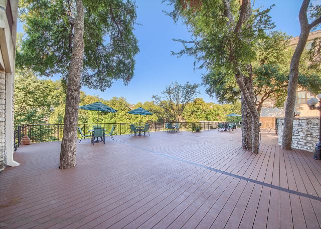 Large deck over looks the swimming pool and the Comal River!
