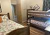 2nd bedroom with a twin over twin bunkbed and a full size bed.
