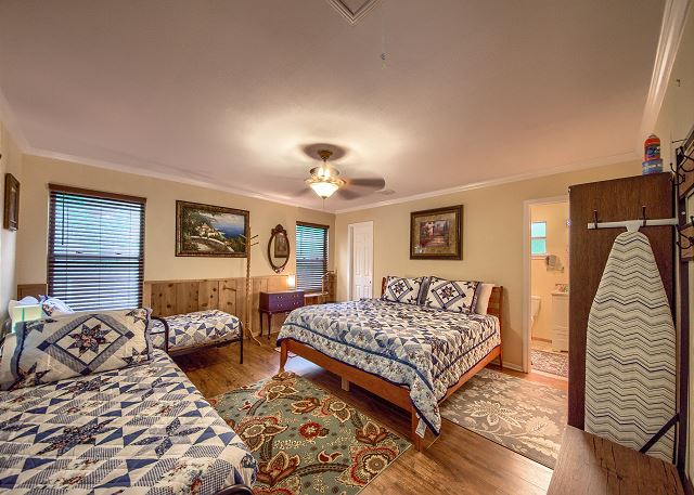 Master Bedroom with a King Size Bed and 2 Twin Beds. 