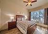 Master bedroom with queen bed and in suite bathroom.