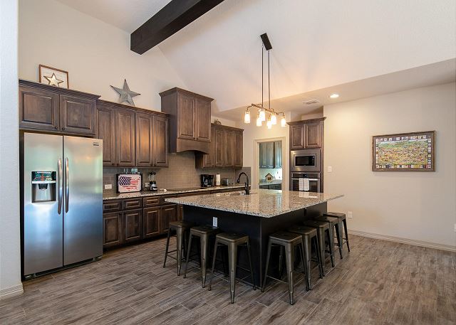 The kitchen has all new appliances and comes fully stocked with cookware, dishes, and utensils. The dining table is perfect for you and your guests sharing a meal together after a day spent on the water! 
