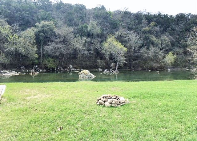 Beautiful backyard with a fire pit! The perfect place to enjoy nights on the Guadalupe River!