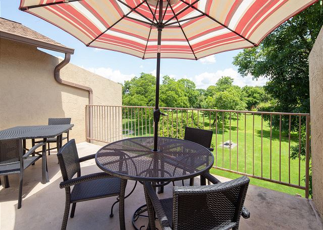 Patio looks out to the beautiful landscaped lawn, huge trees and the Guadalupe River! 