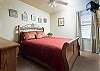 Be our guest! 
Guest bedroom furnished with a beautiful queen size sleigh bed! 

