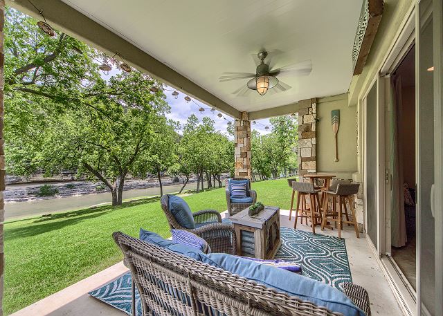 This ground level condo has a covered patio with a great river view!