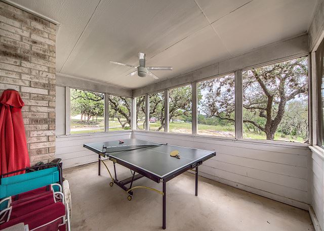enclosed patio with table tennis
