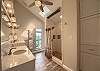  Master en suite bathroom. 
Has a shower with sitting bench, double sinks, commode and skylight. 