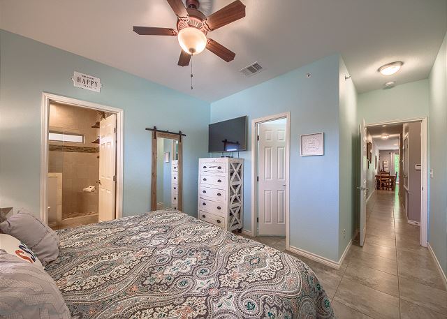 The master bedroom has a King sized bed with premium sheets and bedding and a private bathroom.