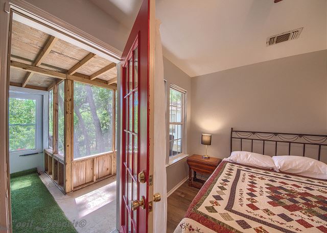 One bedroom downstairs with a queen bed, private screened in porch with river view and a private bathroom. 