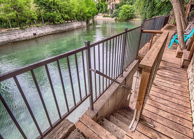 Just a 3 minute walk to the shared river access available May-September!
The stairs are available to enter the river. The deck you see is private to that home.

