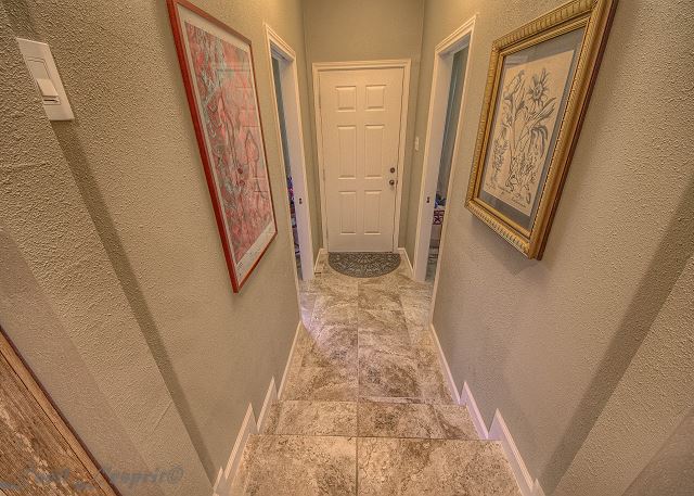 A few steps that lead to the 2nd front door, located in between the 2 guest rooms. 