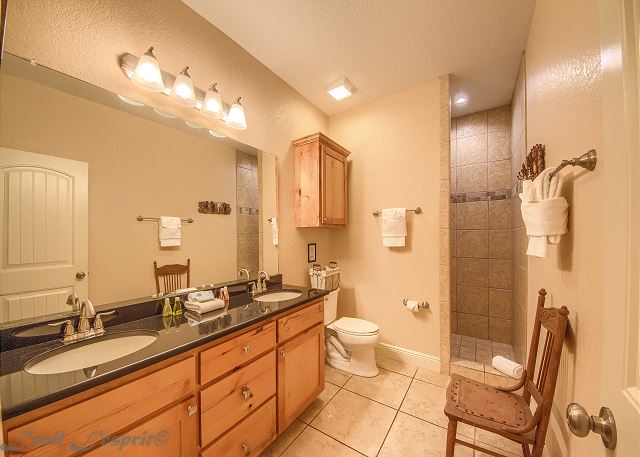 The guest bathroom is conveniently located by the guest’s bedroom. 