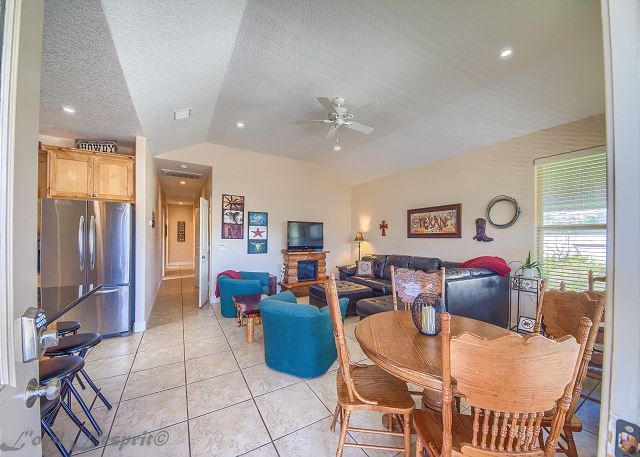 Open kitchen/dining/living room with many extra amenities.