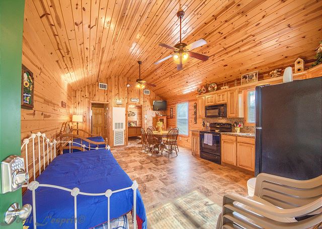 This cozy cabin has an open living/dining/kitchen space. 
