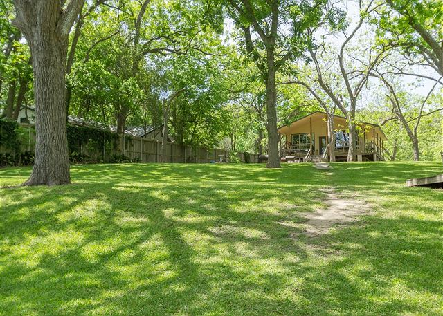 The fenced and gated lot is on approximately 2 acres, with many pecan trees that provide plenty of shade in the summertime. We have ample parking. 