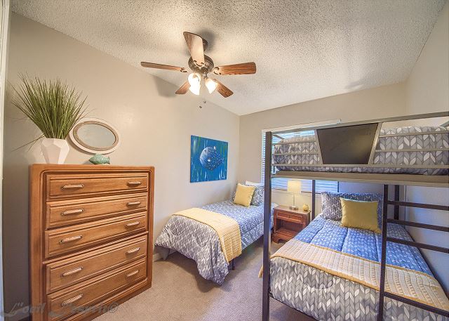 The 3rd bedroom has a twin bed and a twin over twin bunk bed. 