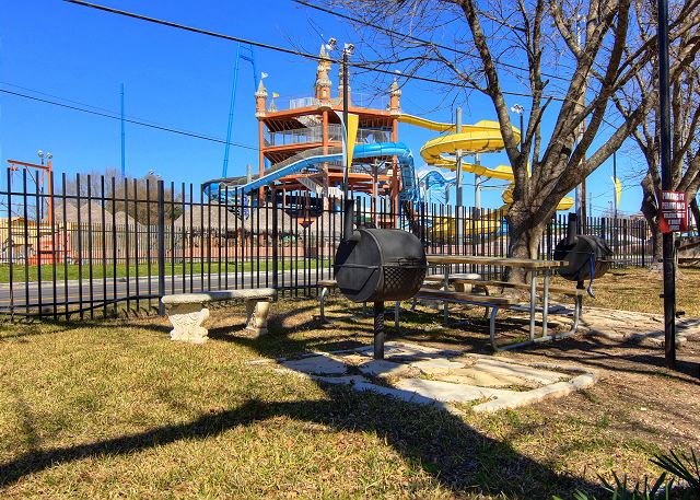 Community Charcoal Grills and Picnic Tables right across the Street from Schlitterbahn. 