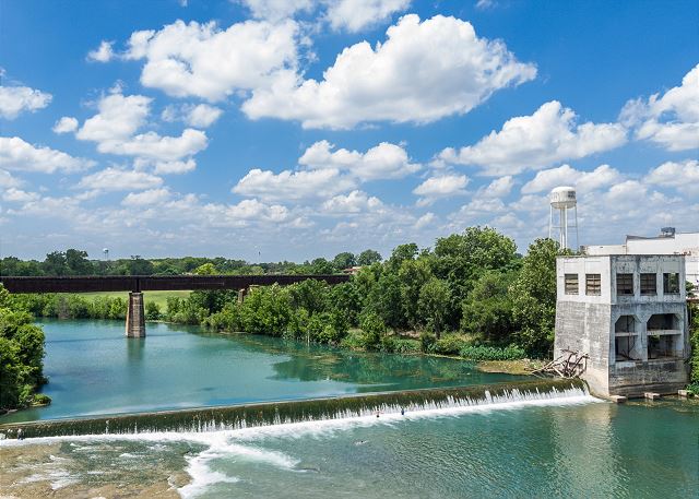 A view from the Faust Street Bridge of the Guadalupe River. 