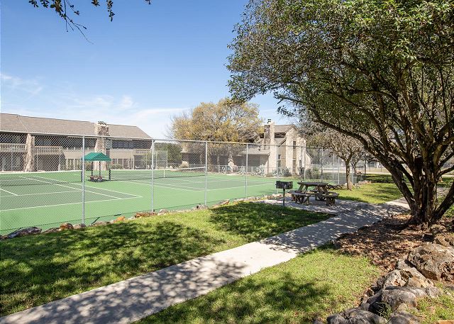 Tennis courts located right outside your backdoor.