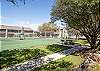 Tennis courts located right outside you backdoor.