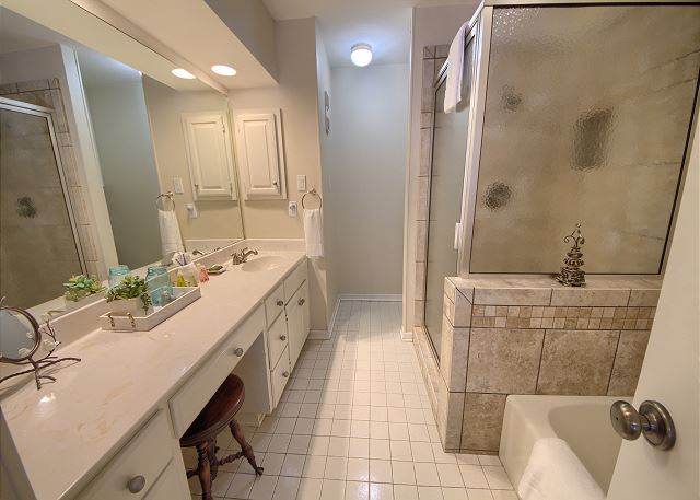 Master Bathroom with a Walk in Shower and Detached Tub.