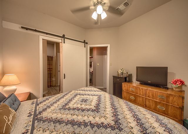 Master bedroom with a King size bed.