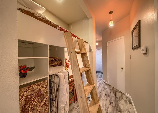 Twin size upper bunk in the hallway.