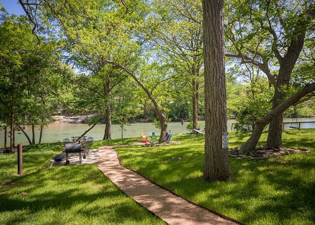 Access to outdoor lounge area with BBQ and fire pits overlooking the Guadalupe River.