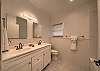 Bathroom with double sinks and tub/shower combo.