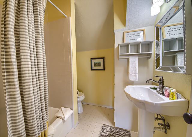 Upstairs Bathroom with a Tub/Shower Combo. 
