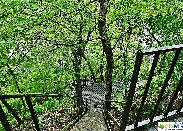 stone/metal steps to your personal 150' river frontage. 157 steps down to the river, decks, and lots of nature. This walk is not for the faint of heart!