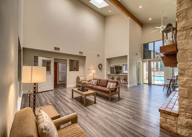 Living room with tall vaulted ceilings.