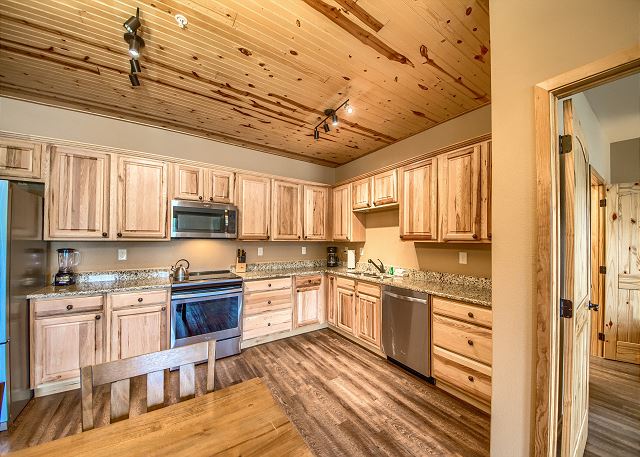 Fully stocked kitchen with stainless steal appliances.