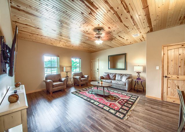 Open living area with a smart TV and sleeper sofa.