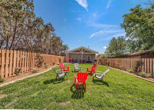 Fenced in backyard with outdoor seating