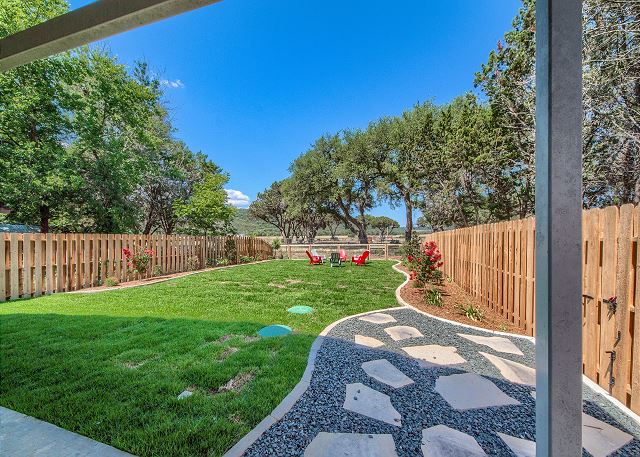 Fenced in backyard. Perfect for your furry friend!