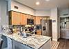Fully equipped kitchen with everything you need to cook and dine, featuring new appliances.