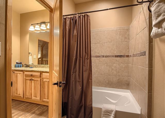 Bathrooms have oversized shower/tub combos
