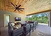 Covered patio equipped with smart TV and firepit